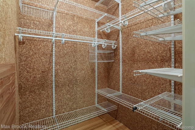 5844 Independence Ln, West Bloomfield, MI 48322 - walk in closet featuring wood finished floors