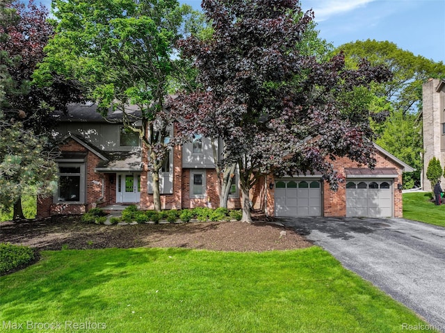 5844 Independence Ln, West Bloomfield, MI 48322 - view of front facade with asphalt driveway, brick siding, a front yard, and a garage