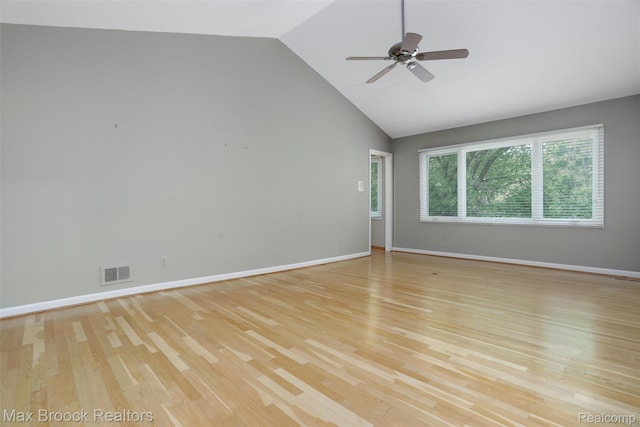 5844 Independence Ln, West Bloomfield, MI 48322 - unfurnished room with light wood-style floors, ceiling fan, baseboards, and high vaulted ceiling