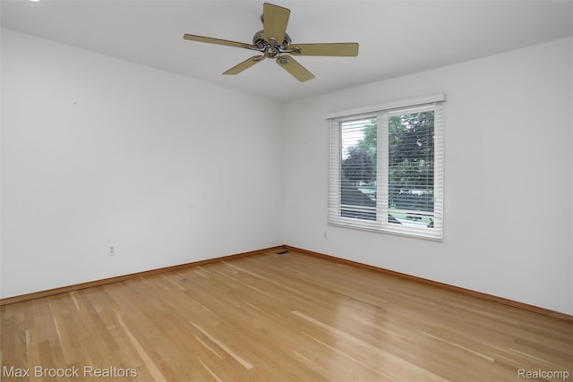 5844 Independence Ln, West Bloomfield, MI 48322 - unfurnished room featuring light wood finished floors, baseboards, and ceiling fan