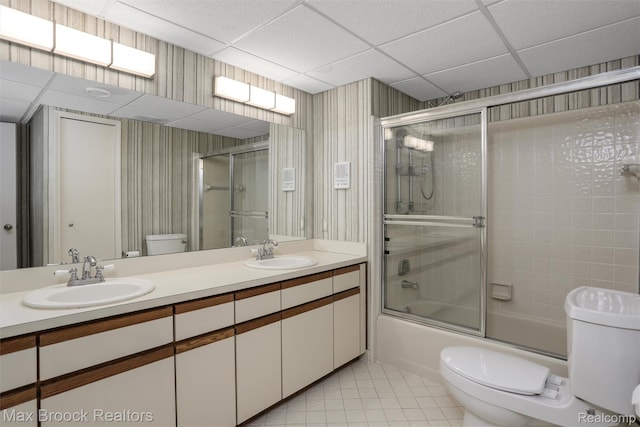 5844 Independence Ln, West Bloomfield, MI 48322 - full bathroom featuring toilet, wallpapered walls, tile patterned floors, shower / bath combination with glass door, and double vanity
