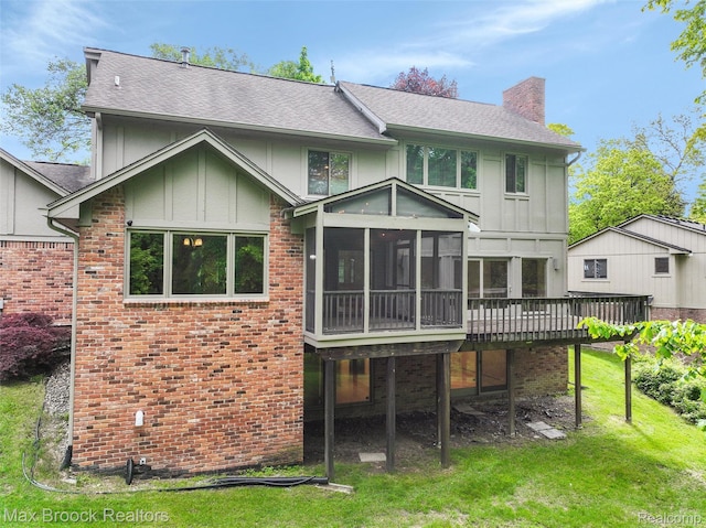5844 Independence Ln, West Bloomfield, MI 48322 - rear view of house featuring a chimney, a sunroom, a yard, and board and batten siding