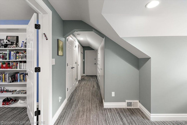 4889 Ardmore Dr, Bloomfield Hills, MI 48302 - hall featuring carpet, vaulted ceiling, arched walkways, and baseboards