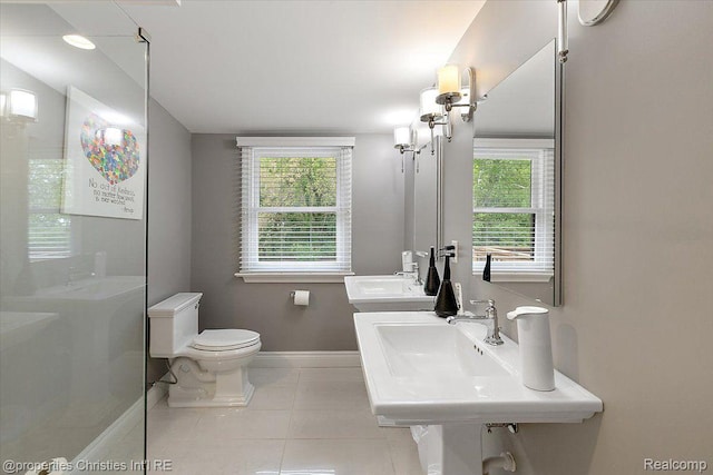 4889 Ardmore Dr, Bloomfield Hills, MI 48302 - bathroom with baseboards, toilet, and tile patterned flooring