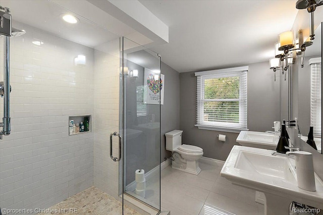 4889 Ardmore Dr, Bloomfield Hills, MI 48302 - full bath with a stall shower, baseboards, tile patterned floors, toilet, and double vanity