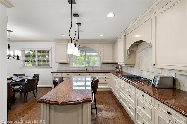 4889 Ardmore Dr, Bloomfield Hills, MI 48302 - kitchen featuring stainless steel gas cooktop, a sink, dark wood-type flooring, a chandelier, and decorative backsplash