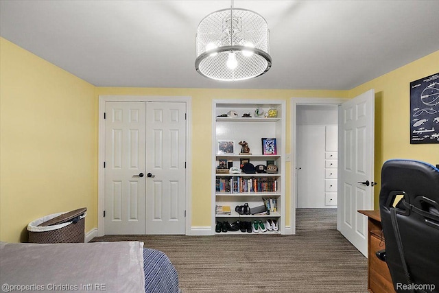 4889 Ardmore Dr, Bloomfield Hills, MI 48302 - bedroom with a chandelier, a closet, baseboards, and carpet