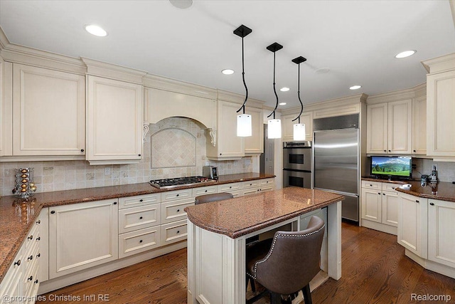 4889 Ardmore Dr, Bloomfield Hills, MI 48302 - kitchen featuring appliances with stainless steel finishes, decorative backsplash, dark wood finished floors, a kitchen island, and recessed lighting