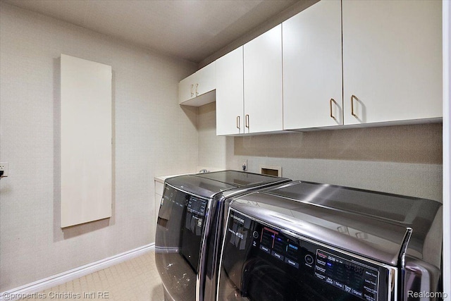 4889 Ardmore Dr, Bloomfield Hills, MI 48302 - laundry area featuring cabinet space, washing machine and dryer, and baseboards