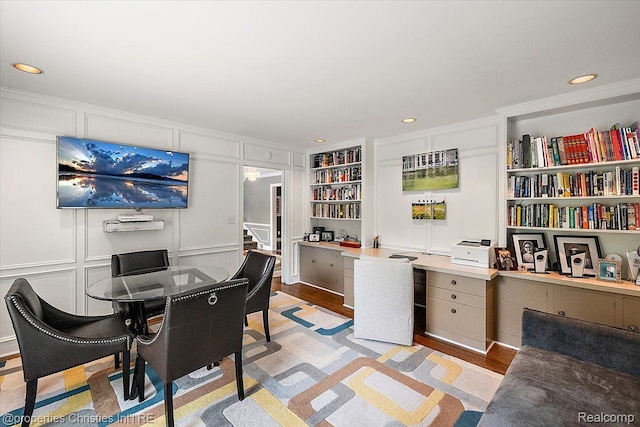 4889 Ardmore Dr, Bloomfield Hills, MI 48302 - office space featuring a decorative wall, built in shelves, ornamental molding, recessed lighting, and light wood-type flooring