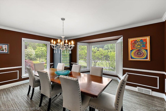 4889 Ardmore Dr, Bloomfield Hills, MI 48302 - carpeted dining area with a chandelier, ornamental molding, baseboards, and healthy amount of natural light