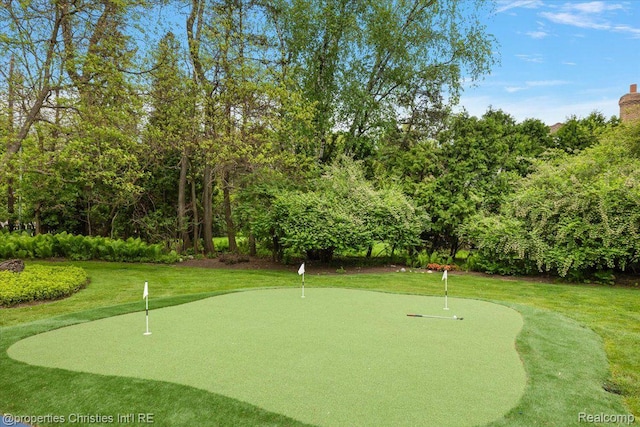 4889 Ardmore Dr, Bloomfield Hills, MI 48302 - view of home's community with an area to practice putting, a yard, and golf course view