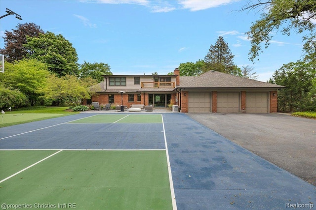 4889 Ardmore Dr, Bloomfield Hills, MI 48302 - view of front of home with a chimney, a garage, brick siding, and a balcony