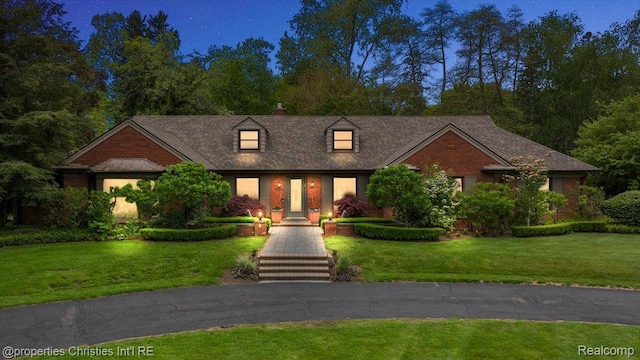4889 Ardmore Dr, Bloomfield Hills, MI 48302 - cape cod-style house featuring a front yard and brick siding