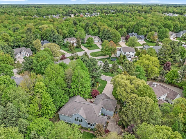 6371 Colorado Ct, Norton Shores, MI 49441 - aerial perspective of suburban area with a heavily wooded area