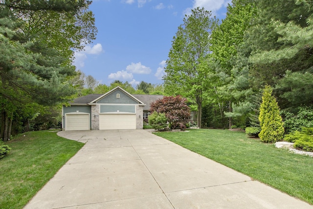 6371 Colorado Ct, Norton Shores, MI 49441 - view of front facade featuring driveway, an attached garage, and a front lawn