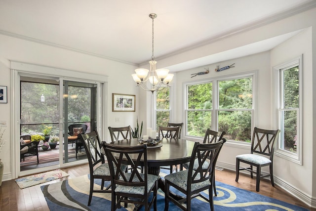 6371 Colorado Ct, Norton Shores, MI 49441 - dining area featuring hardwood / wood-style floors, a chandelier, ornamental molding, and baseboards