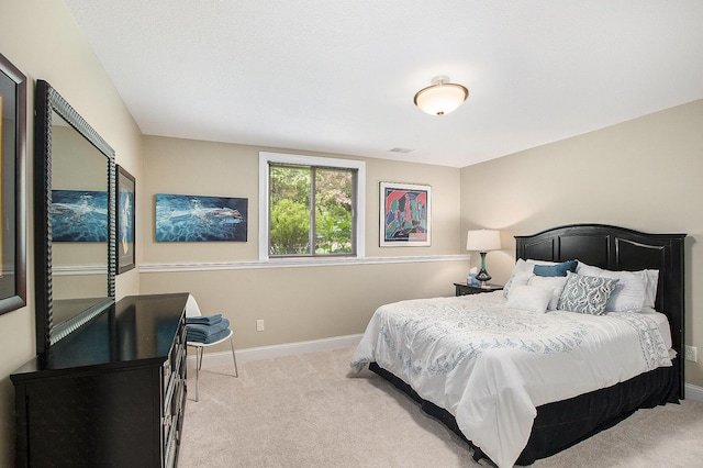 6371 Colorado Ct, Norton Shores, MI 49441 - bedroom with light carpet and baseboards