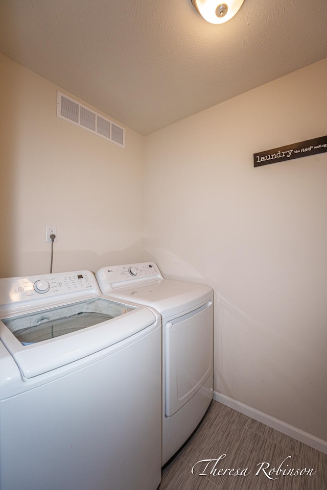 4240 Butternut Dr, Wayland, MI 49348 - laundry room with separate washer and dryer and baseboards