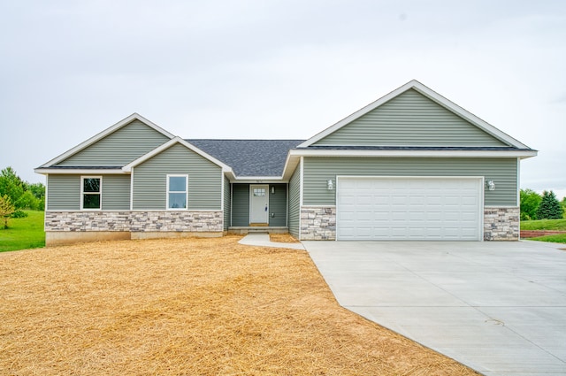 9674 Iosco Ridge Dr, Gregory, MI 48137 - view of front of property featuring stone siding, an attached garage, concrete driveway, and roof with shingles