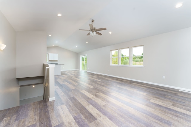 9674 Iosco Ridge Dr, Gregory, MI 48137 - unfurnished living room with ceiling fan, lofted ceiling, wood finished floors, recessed lighting, and baseboards