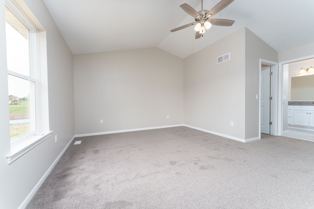 9674 Iosco Ridge Dr, Gregory, MI 48137 - unfurnished bedroom featuring carpet floors, lofted ceiling, baseboards, ensuite bath, and ceiling fan