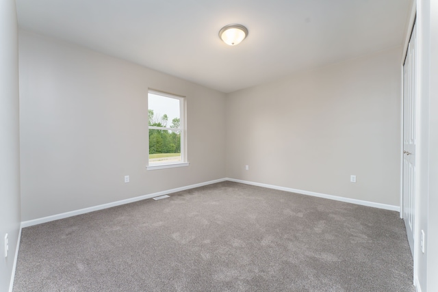 9674 Iosco Ridge Dr, Gregory, MI 48137 - carpeted empty room featuring baseboards