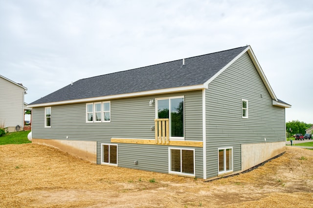 9674 Iosco Ridge Dr, Gregory, MI 48137 - rear view of property featuring roof with shingles