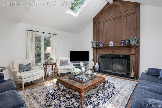 3445 Medford Dr, Troy, MI 48084 - living room with lofted ceiling, a skylight, a fireplace, and wood finished floors