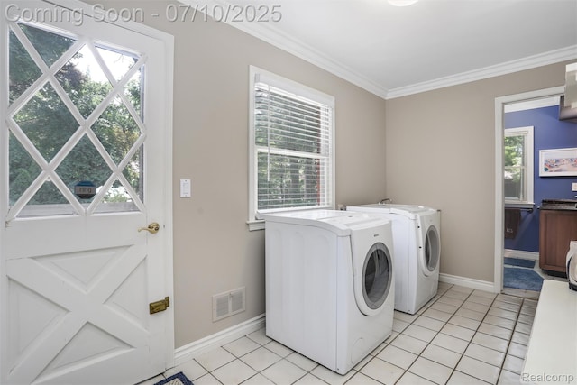 3445 Medford Dr, Troy, MI 48084 - laundry room featuring washer and clothes dryer, ornamental molding, and light tile patterned flooring