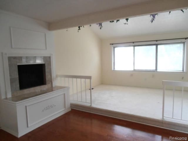 5086 Falmouth Dr, Troy, MI 48085 - unfurnished living room with wood finished floors and a high end fireplace