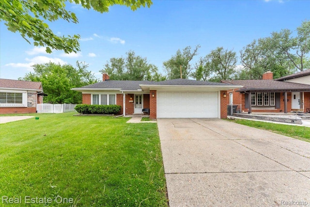 16917 Cicotte Ave, Allen Park, MI 48101 - view of front of property featuring an attached garage, brick siding, a chimney, and driveway