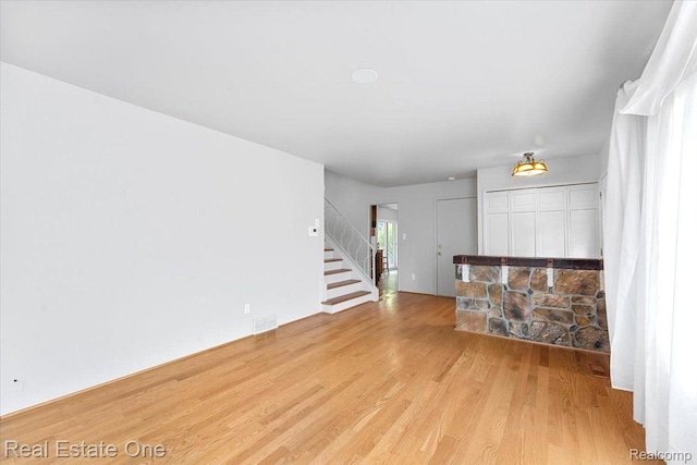 16917 Cicotte Ave, Allen Park, MI 48101 - unfurnished living room with wood finished floors and stairs