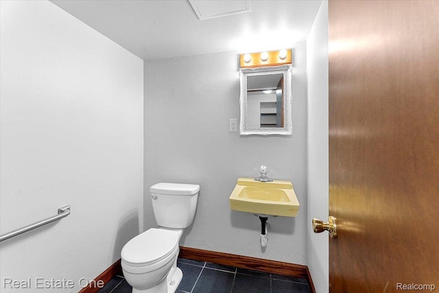16917 Cicotte Ave, Allen Park, MI 48101 - half bath featuring toilet, tile patterned flooring, baseboards, and a sink