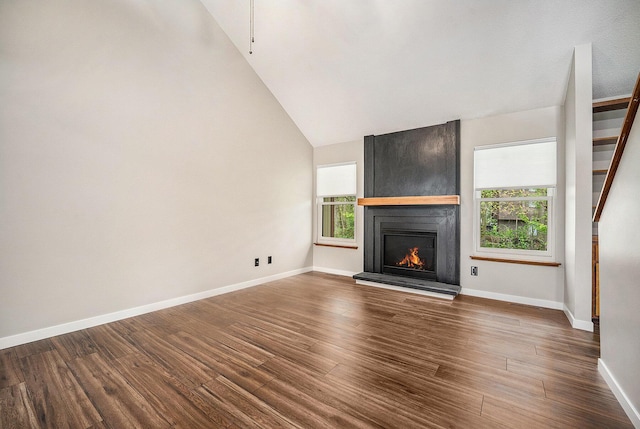 2373 Fairgrove St, Kalamazoo, MI 49009 - unfurnished living room featuring a fireplace, dark wood finished floors, baseboards, stairs, and high vaulted ceiling