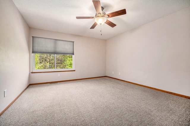 2373 Fairgrove St, Kalamazoo, MI 49009 - empty room featuring carpet, baseboards, and ceiling fan