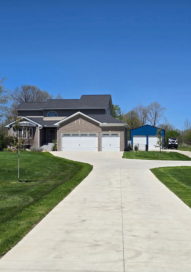 20223 32 Mile Rd, Armada, MI 48005 - view of front of home featuring concrete driveway, a front lawn, brick siding, and a garage