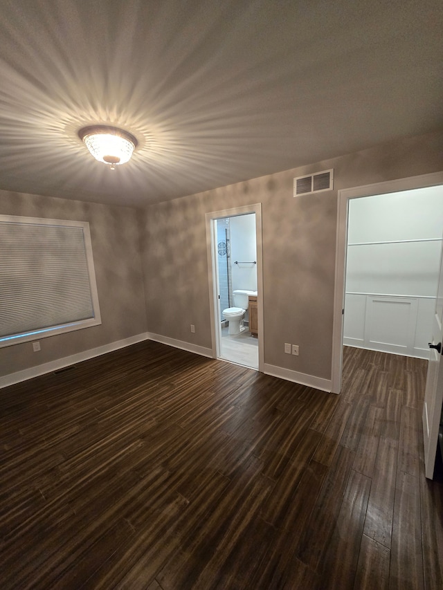 20223 32 Mile Rd, Armada, MI 48005 - empty room featuring dark wood-style flooring and baseboards