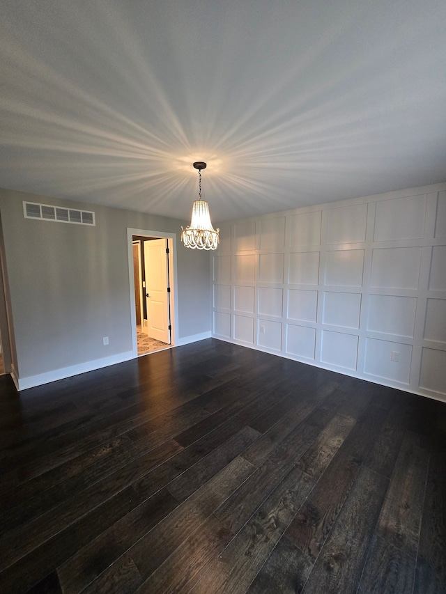 20223 32 Mile Rd, Armada, MI 48005 - unfurnished room with dark wood-type flooring, a chandelier, and baseboards