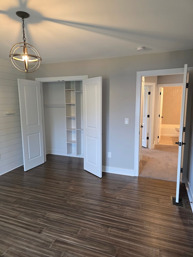 20223 32 Mile Rd, Armada, MI 48005 - unfurnished bedroom featuring a closet, dark wood-type flooring, and baseboards