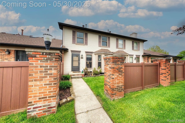 41381 Northwind Dr, Canton, MI 48188 - view of front of home featuring brick siding and a chimney