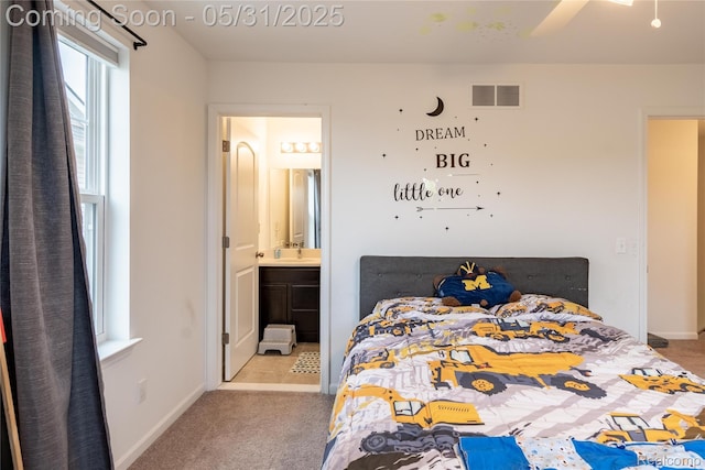 3217 Chambers W Unit 87, Wixom, MI 48393 - carpeted bedroom featuring ensuite bathroom, baseboards, and a sink
