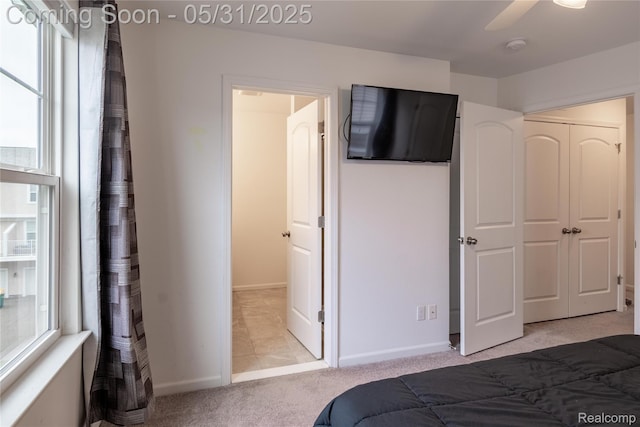 3217 Chambers W Unit 87, Wixom, MI 48393 - bedroom with light carpet, baseboards, and ceiling fan