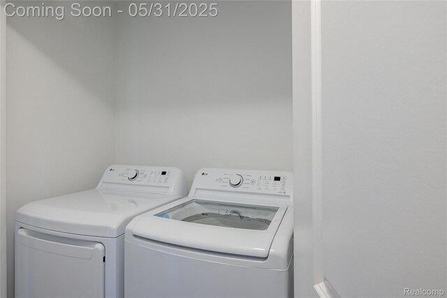 3217 Chambers W Unit 87, Wixom, MI 48393 - washroom with washing machine and dryer