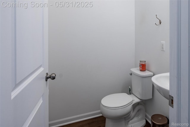 3217 Chambers W Unit 87, Wixom, MI 48393 - bathroom with wood finished floors, toilet, and baseboards