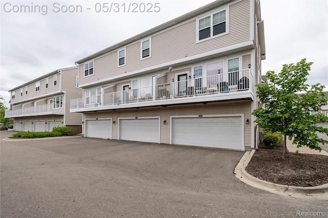 3217 Chambers W Unit 87, Wixom, MI 48393 - back of property featuring driveway and a garage