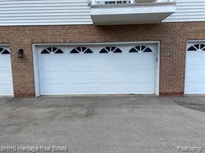 798 Olde English Cir, Howell, MI 48855 - garage featuring driveway