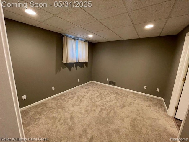 8241 Fountain View Dr, Flushing, MI 48433 - finished below grade area with carpet, recessed lighting, a paneled ceiling, and baseboards
