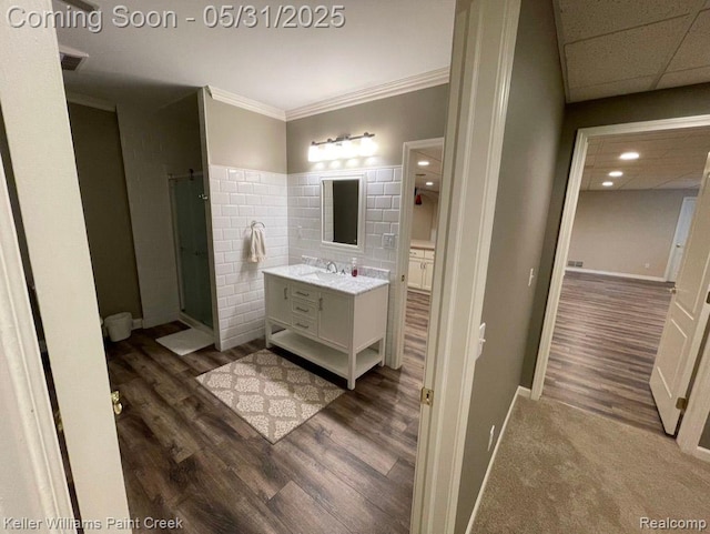 8241 Fountain View Dr, Flushing, MI 48433 - full bath with vanity, wood finished floors, a stall shower, crown molding, and baseboards
