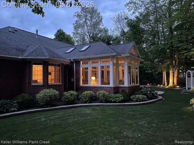 8241 Fountain View Dr, Flushing, MI 48433 - back of property featuring brick siding, a lawn, and roof with shingles